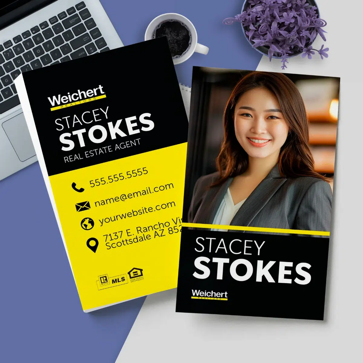 A vertical Weichert business card with a laptop and purple theme background.
